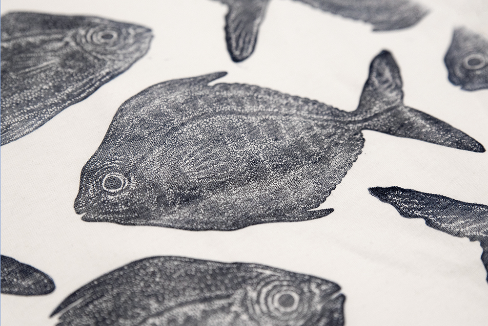 Print of a fish linocut on the fabric